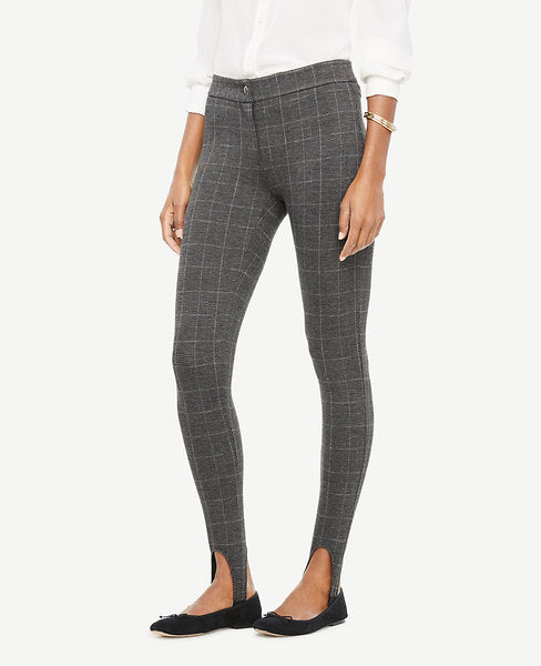 Meet your real-life uniform: this is Luxewear. Every day. Every wear. In smart plaid - and styled with sleek stirrups - our soft and stretchy ponte leggings are a modern take on a classic. Contoured waistband. Front zip with snap closure. Back yoke. Elasticized stirrups. 27 inseam.