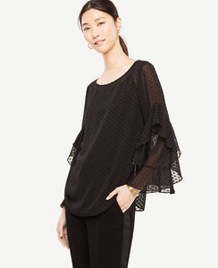 Cascading ruffle sleeves add modern fluidity to this romantically refined top. Boatneck. Long ruffle sleeves. Shirttail hem. 26 1/2 long.