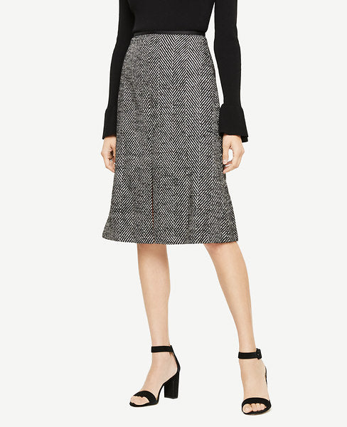 We've modernized this timeless herringbone skirt with a flattering front slit and A-line silhouette. Hidden back zipper with hook-and-eye closure. Front slit. Lined. 27 long.