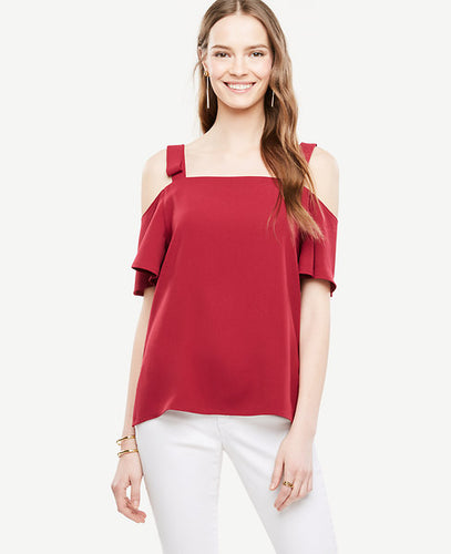 We're presenting this shoulder-baring top with pretty bows for a fresh and feminine twist. Square neckline with bow shoulder straps. Short sleeves. Side slits. 19 long.