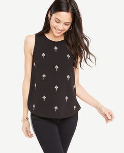 Add instant sparkle to the season with this brilliantly embellished shell. Jewel neck. Sleeveless. Side slits. Hidden back zipper with hook-and-eye closure. Lined front. 24 long.