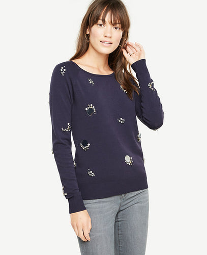 Brilliant embellishments take our irresistibly soft sweater from everyday classic to a season-perfect dazzler. Jewel neck. Long raglan sleeves. Ribbed cuffs and hem. 23 long.