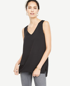 Our stepped hem tank is the silhouette that takes you everywhere - from weekday meetups to holiday festivities. V-neck. Sleeveless. Side slits. Hi-lo hem. 27 front length; 28 1/2 back length.