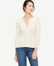 We've updated our classic cardigan with a pretty peplum hem for a fresh and feminine spin. Crew neck. Long sleeves. Button front. Peplum hem. 23 1/2 long.