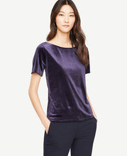 Plush velvet turns this forever favorite tee into a total covetable. Jewel neck. Short sleeves. Back vent. 24 long.