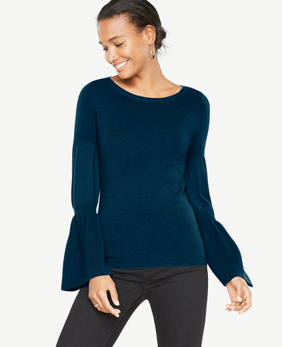 We've upgraded this extrafine merino wool sweater with flared statement sleeves for a season-perfect silhouette. Ribbed boatneck. Long sleeves with ribbing at upper sleeve and cuffs. 24 long.