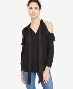 A romantic tie neck and shoulder-baring cutouts take this beautifully draped blouse to the top of our wish list. Stand collar with self tie. Long sleeves with button closure. Raglan ruffle seams with pleats beneath. Shirttail hem. 28 1/2 long.