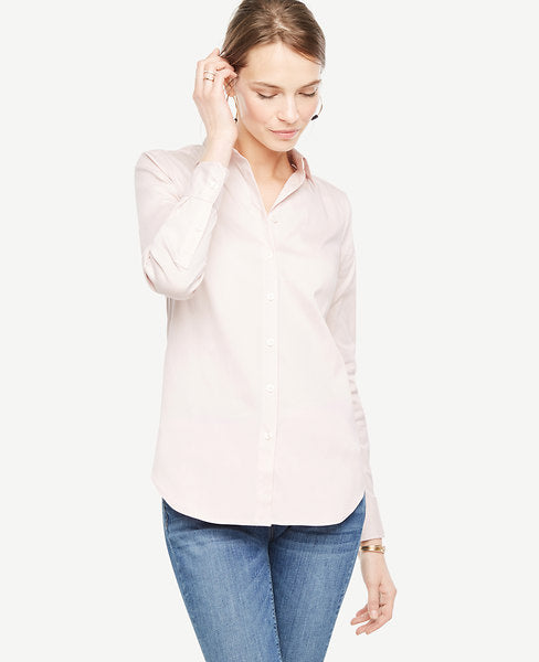 We love the classic appeal of a crisp button-down with a touch of modern stretch. Point collar. Long sleeves with button closure. Button front. Back yoke. Shirttail hem.