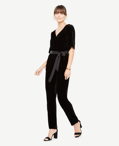 Go beyond the LBD this party season with our plush velvet jumpsuit - because best-dressed doesn't always mean a dress. V-neck. Short sleeves. Self tie belt. Tunneled elastic waistband. Front off-seam pockets. Hidden back zipper with hook-and-eye closure. Lined bodice. 26 1/2 inseam.