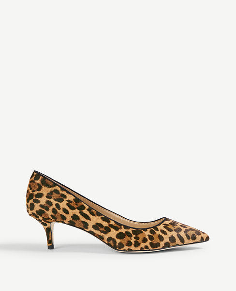 A sleek silhouette in leopard print haircalf makes this well-heeled pair a versatile favorite. Pointy toe. Padded footbed for complete comfort. Covered 1 3/4 inch heel.