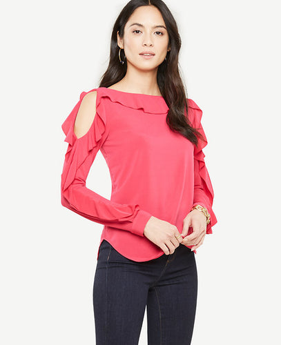 Romantic ruffles turn this shoulder baring style into a true statement-maker. Boatneck. Long sleeves with cuffs. 23 1/2 long.