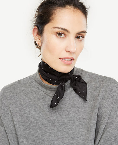 Play up your look with our silk polka dot scarf - a spot-on accessory for the season.