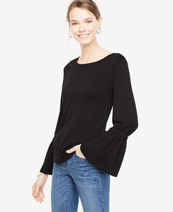 Bell sleeves ring in this soft and versatile knit with feminine flair. Jewel neck. Long sleeves with tunneled elasticized flare cuffs. 25 long.