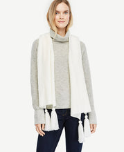 Pointelle detail and refined tassels make this soft knit scarf equal parts stylish and cozy. Tassels at ends. 15 x 83.