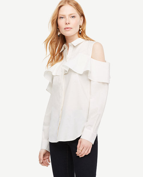 We've refreshed our crisp cotton button-down for spring with feminine flounce and shoulder baring cutouts. Point collar. Long sleeves with button closure and flounce at top. Hidden button front. Shirttail hem. 27 long.