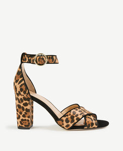 We've paired sleek leopard print haircalf with a modern block heel for a look that's completely spot-on. Open toe. Adjustable buckle at side ankle for secure fit. Padded footbed for complete comfort. Covered 3 1/2 heel.