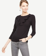 We gave this refined knit a bit of flounce with a V-shaped ruffle - and a flattering ribbed stitch. Jewel neck. 3/4 sleeves. 25 long.