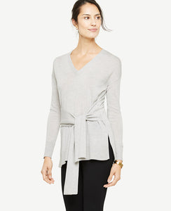 Meet your real-life uniform: this is Luxewear. Every day. Every wear. Our extrafine merino wool sweater brings it all together with a flattering front waist tie. V-neck. Long sleeves. Self side ties. Side slits. Ribbed cuffs and hem. 28 long.