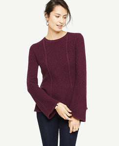 Our feminine peplum gets a season-perfect refresh with novelty stitching and breezy bell sleeves. Ribbed jewel neck. Long sleeves. Peplum hem. 25 1/2 long.