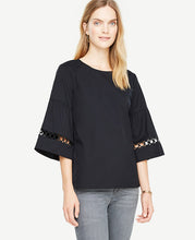We've punched up this flare sleeve top with circle lace insets for a season-fresh look that's light and airy. Jewel neck. 3/4 sleeves with shirred cuffs and lace insets. Back slit with button closure. 24 1/4 long.