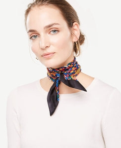 Vibrant colors and mini florals saturate this picture-perfect silk little scarf. 25 x 25.