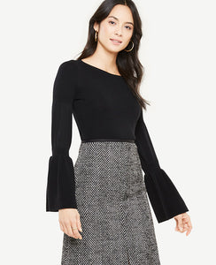 We've upgraded this extrafine merino wool sweater with flared statement sleeves for a season-perfect silhouette. Ribbed boatneck. Long sleeves with ribbing at upper sleeve and cuffs. 25 long.