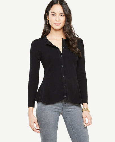 We've updated our classic cardigan with a pretty peplum hem for a fresh and feminine spin. Crew neck. Long sleeves. Button front. Peplum hem. 23 1/2 long.