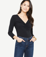 Meet your real-life uniform: this is Luxewear. Every day. Every wear. Romantic ruching takes this beautifully fitted V-neck from daytime to date night. V-neck. 3/4 sleeves. 25 1/4 long.