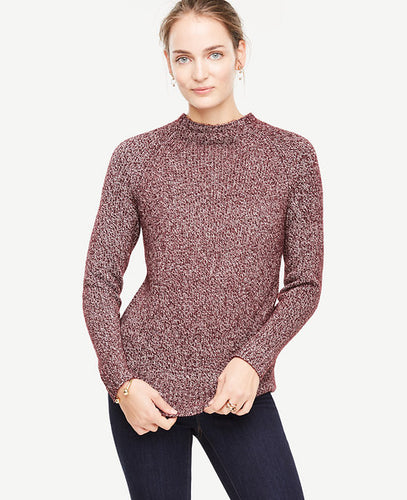 There's no better piece than a mock neck sweater to take you into fall - especially with refined fabrications and innovative stitch detail. Mock neck. Long raglan sleeves. Ribbed cuffs and hem. 23 1/2 long.