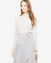 There's no better piece than a mock neck sweater to take you into fall - especially with refined fabrications and innovative stitch detail. Mock neck. Long raglan sleeves. Ribbed cuffs and hem. 23 1/2 long.