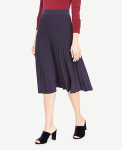 A hint of shimmer adds sparkling personality to our prettily pleated sweater skirt. Encased elastic waistband. 25 front length; 25 1/2 back length.