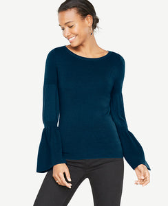 We've upgraded this extrafine merino wool sweater with flared statement sleeves for a season-perfect silhouette. Ribbed boatneck. Long sleeves with ribbing at upper sleeve and cuffs. 25 long.