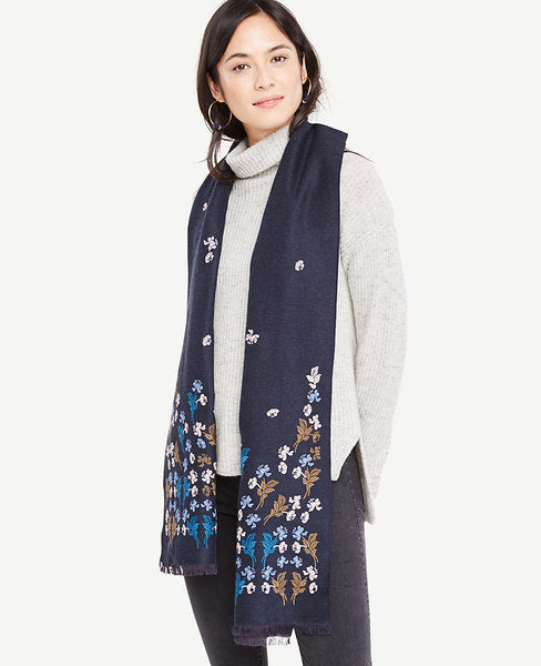 Floral embroidery adds refined detail and texture to this lightly fringed scarf - in a bouquet of fresh color. Light fringe at ends.