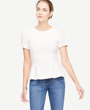 Bubble sleeves and precise pleats transform this structured crepe piece into a statement making must-have. Jewel neck. Short sleeves with pleated sleeve caps and cuffs. Inverted front waist pleats. Hidden back zipper with hook-and-eye closure. 24 long.