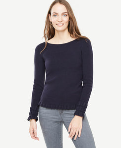 Our refined boatneck sweater ruffles things up with pretty smocked detail at the cuffs and hem. Boatneck. Long sleeves with ruffle cuffs. Ruffle hem. Ribbed cuffs and hem. 23 1/4 long.